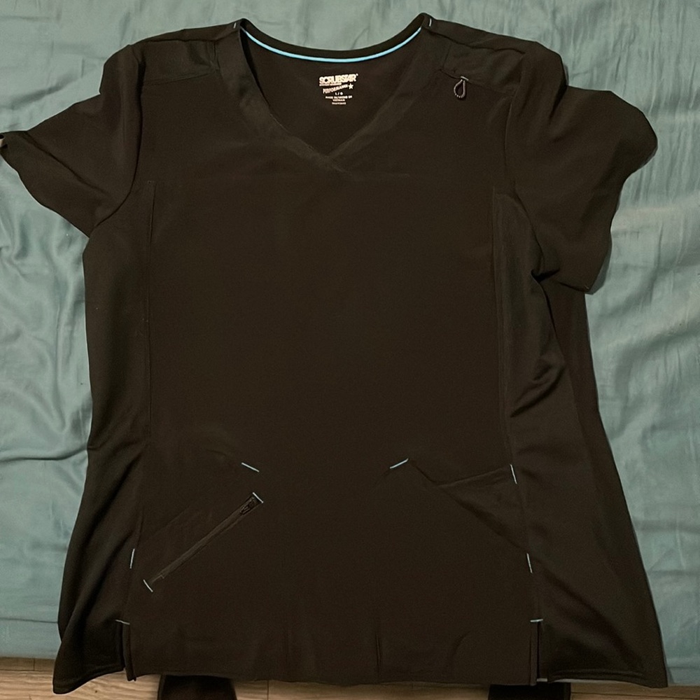 I bought two of the same scrubs shirts. size Large. Never worn. Brand new.